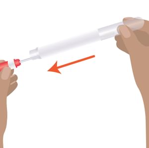 Two hands preparing a syringe, removing the red needle cap; orange arrow indicates backward motion.