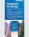 Tall ad banner showing a hand holding a smartphone with a blue SunSmart on the go app screen.