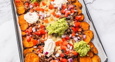 Healthy Mexican-style loaded nachos on a tray