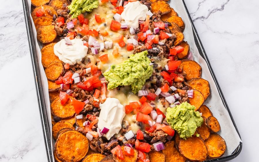 Healthy Mexican-style loaded nachos on a tray